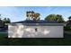 Rear view of a single story house with gray siding and two windows at 542 N Charles St, Daytona Beach, FL 32114