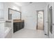 Main bathroom with double vanity, soaking tub, and bedroom access at 555 Morgan Wood Dr, Deland, FL 32724