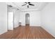 Spacious bedroom with wood-look floors and access to bathroom at 555 Morgan Wood Dr, Deland, FL 32724