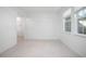 Bright bedroom with tile floors and access to hallway at 555 Morgan Wood Dr, Deland, FL 32724
