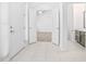 Spacious entryway with tile floors and access to the living room and bathroom at 555 Morgan Wood Dr, Deland, FL 32724