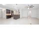 Open kitchen with dark cabinets, granite counters, and stainless steel appliances at 555 Morgan Wood Dr, Deland, FL 32724