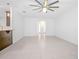 Open living room with tile floors and archway to hallway at 555 Morgan Wood Dr, Deland, FL 32724