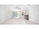 Bright and spacious living room with tile floors and ceiling fan at 555 Morgan Wood Dr, Deland, FL 32724