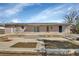 Back of house and backyard featuring a large patio area and yard at 641 Hartley Ave, Deltona, FL 32725