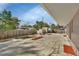 Spacious backyard with large tiled patio, fenced yard, and 2 sheds at 641 Hartley Ave, Deltona, FL 32725