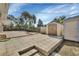 Backyard with large patio featuring landscaping and storage sheds at 641 Hartley Ave, Deltona, FL 32725