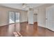 Bedroom with a ceiling fan, sliding glass door, hardwood floors, and a white closet door at 641 Hartley Ave, Deltona, FL 32725
