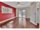 Empty bedroom featuring a sliding glass door, ceiling fan, and rich hardwood floors at 641 Hartley Ave, Deltona, FL 32725