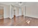 Spacious bedroom with hardwood floors and two open doorways leading to the bathroom and closet at 641 Hartley Ave, Deltona, FL 32725