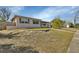 Exterior view of the home showcasing the front yard and facade at 641 Hartley Ave, Deltona, FL 32725