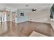Spacious living room with hardwood floors, a ceiling fan, and ample natural light from the sliding glass door at 641 Hartley Ave, Deltona, FL 32725