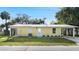 Newly constructed yellow house with carport and landscaped yard at 642 Bellevue Ave, Daytona Beach, FL 32114