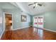 Bright and airy living room with hardwood floors, vaulted ceilings, and French doors leading to a screened-in porch at 709 Lone Oak Dr, Port Orange, FL 32127
