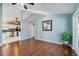 Inviting living room with hardwood floors, vaulted ceilings, and an open layout leading to the kitchen and screened-in porch at 709 Lone Oak Dr, Port Orange, FL 32127