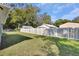 Landscaped backyard with a fenced perimeter at 731 E Cox St, Deland, FL 32724