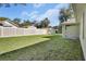 Private backyard with fenced perimeter and grassy area at 731 E Cox St, Deland, FL 32724