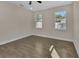 Spacious bedroom with two windows and ceiling fan at 731 E Cox St, Deland, FL 32724