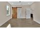 Bedroom with barn door and access to bathroom at 731 E Cox St, Deland, FL 32724
