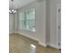 Bright dining area with large windows and wood-look tile floors at 731 E Cox St, Deland, FL 32724