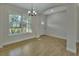 Spacious dining room with archways and wood-look tile floors at 731 E Cox St, Deland, FL 32724