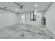 Spacious garage with an overhead door and ample storage at 731 E Cox St, Deland, FL 32724