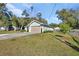 Front view of house with driveway and landscaping at 731 E Cox St, Deland, FL 32724