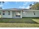 Back exterior view, showcasing a covered patio at 731 E Cox St, Deland, FL 32724