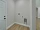 Laundry area with built-in cabinets and a utility sink at 731 E Cox St, Deland, FL 32724