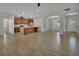 Open concept living room and kitchen with tile floors at 731 E Cox St, Deland, FL 32724