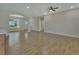 Open concept living room with archways and wood-look tile floors at 731 E Cox St, Deland, FL 32724