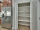 Walk-in pantry with white shelves offering extra storage at 731 E Cox St, Deland, FL 32724