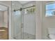 Bathroom with a large walk-in shower and marble tile at 731 E Cox St, Deland, FL 32724