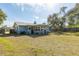 Light blue single story home with large backyard at 89 Rosewood Ave, Ormond Beach, FL 32174