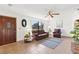 Living room with tiled floors and a brown leather sofa at 89 Rosewood Ave, Ormond Beach, FL 32174