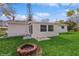 Spacious backyard with fire pit and detached shed at 916 Tracy St, Daytona Beach, FL 32117