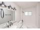Updated bathroom with granite vanity, new fixtures, and subway tile at 916 Tracy St, Daytona Beach, FL 32117