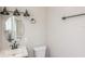 Updated bathroom with vanity, toilet, and modern fixtures at 916 Tracy St, Daytona Beach, FL 32117