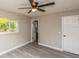 Bedroom with ceiling fan and access to bathroom at 916 Tracy St, Daytona Beach, FL 32117