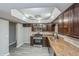 Updated kitchen with granite countertops and wood cabinets at 916 Tracy St, Daytona Beach, FL 32117