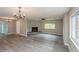 Spacious living room featuring a fireplace and wood-look floors at 916 Tracy St, Daytona Beach, FL 32117