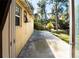 View of backyard patio and surrounding trees at 101 Los Arbor Dr, Deland, FL 32724