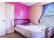 Cozy bedroom with a large window, closet, and a comfortable bed at 101 Los Arbor Dr, Deland, FL 32724