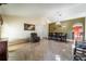 Bright dining room with a large table and access to the living area at 101 Los Arbor Dr, Deland, FL 32724