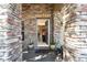 Inviting front entrance with stone columns and a view into the home at 101 Los Arbor Dr, Deland, FL 32724
