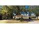 Charming single-Gathering house with a well-manicured lawn and attached garage at 101 Los Arbor Dr, Deland, FL 32724