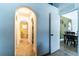 Hallway with arched doorways leading to bedrooms and closets at 101 Los Arbor Dr, Deland, FL 32724