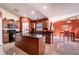 Large kitchen with island and dark countertops at 101 Los Arbor Dr, Deland, FL 32724