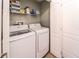 Laundry room featuring a front loading washer and dryer and wire shelving at 101 Los Arbor Dr, Deland, FL 32724