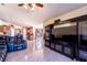 Living room with large TV and leather reclining furniture at 101 Los Arbor Dr, Deland, FL 32724